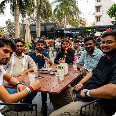 A diverse group of people engaged in conversation while sitting around a table
