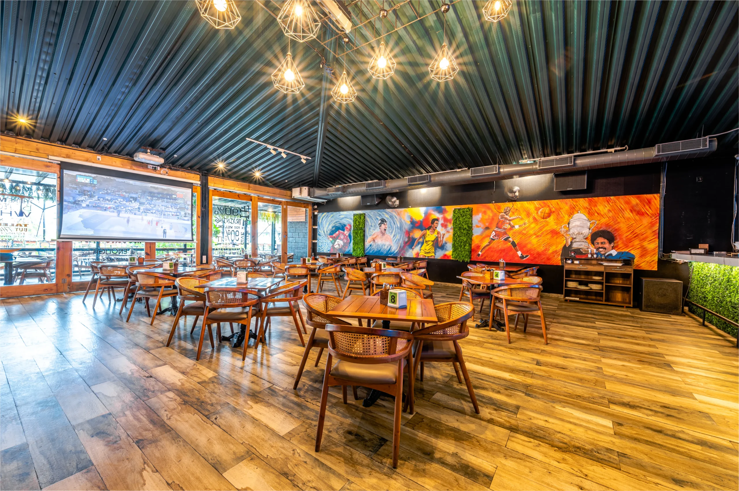 A large mural decorates the wall of the restaurant, adding vibrant color and artistic flair to the dining atmosphere