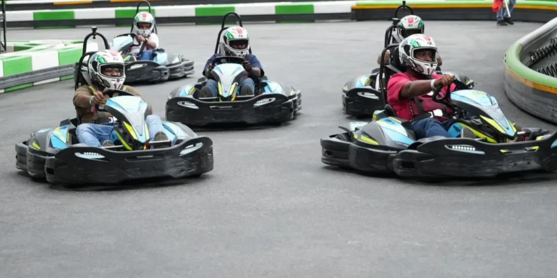 image shown of go-karting on the track for coporate team outing