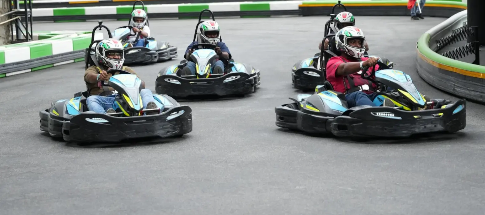 image shown of go-karting on the track for coporate team outing
