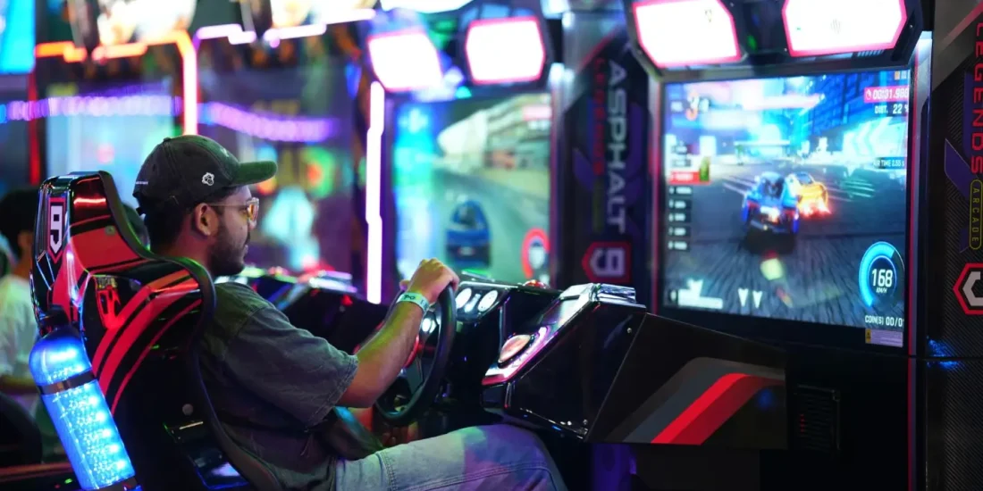 image shown of a boy playing on arcade game