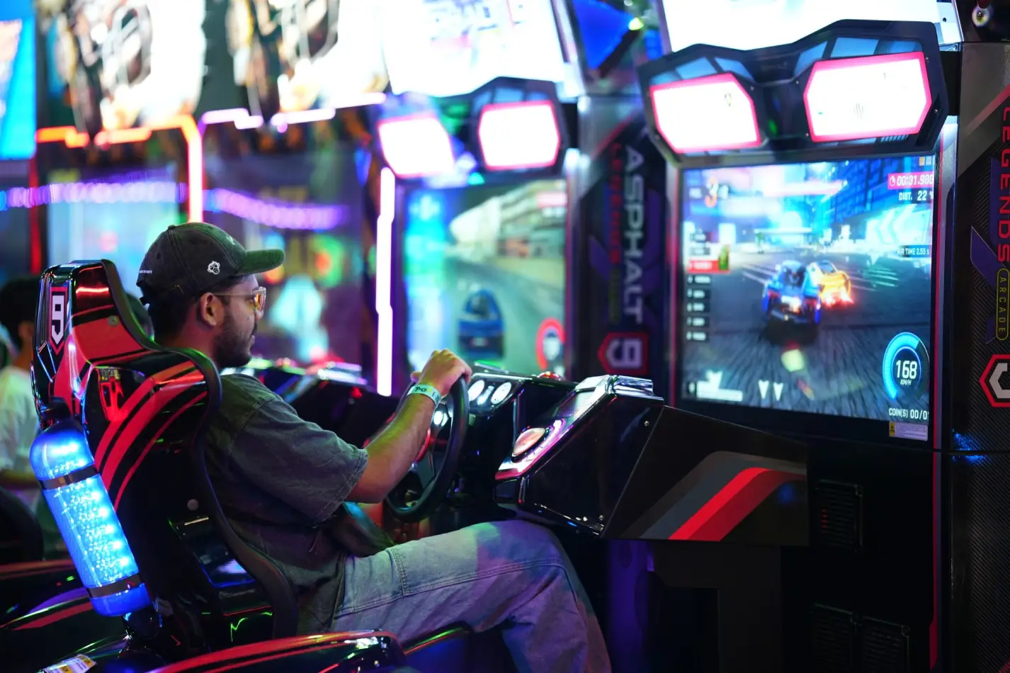 image shown of a boy playing on arcade game