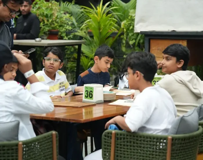 image shown of people sitting for - Celebrating Birthdays in Bangalore? Make It More Than Just Dinner